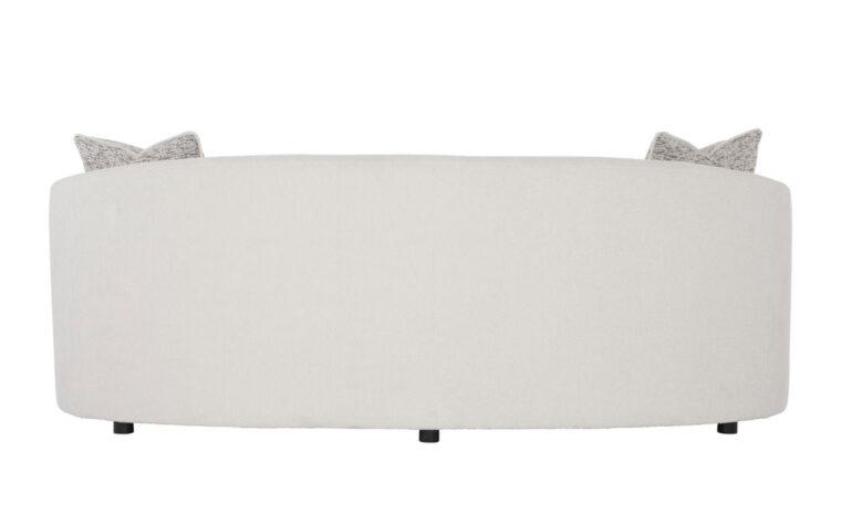 Back view of the Elle modern curved sofa from Bernhardt in a cream boucle fabric with three throw pillows and dark wood feet