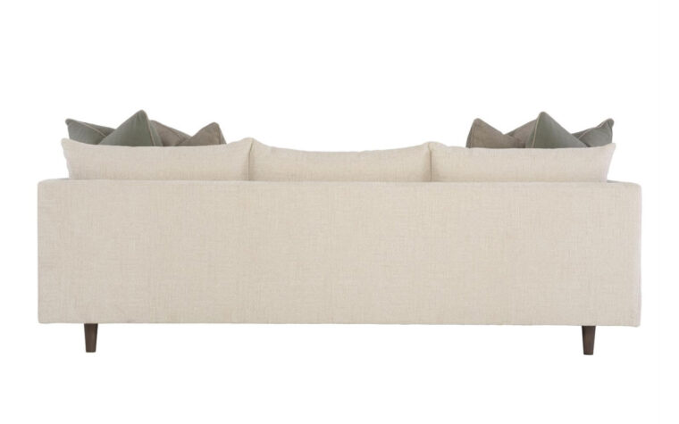 Back view of the Colette stylish modern sofa by Bernhardt in cream fabric with two green throw pillows on either side
