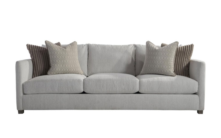 The Rory traditional sofa by Bernhardt in gray fabric with beige and brown thrown pillows on either side