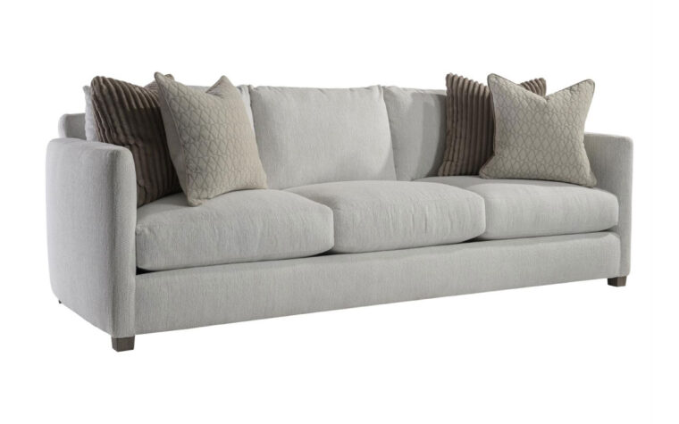 Angled view of the Rory traditional sofa by Bernhardt in gray fabric with beige and brown thrown pillows on either side