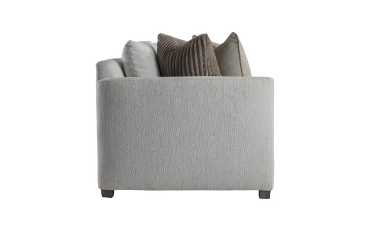 Side view of the Rory traditional sofa by Bernhardt in gray fabric with beige and brown thrown pillows on either side