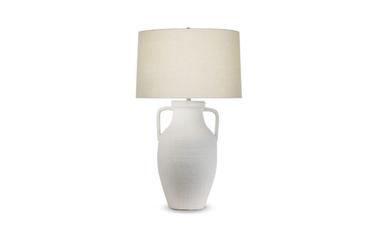 The classic Delilah Tapered Table Lamp with textured white ceramic base and beige cotton lamp shade