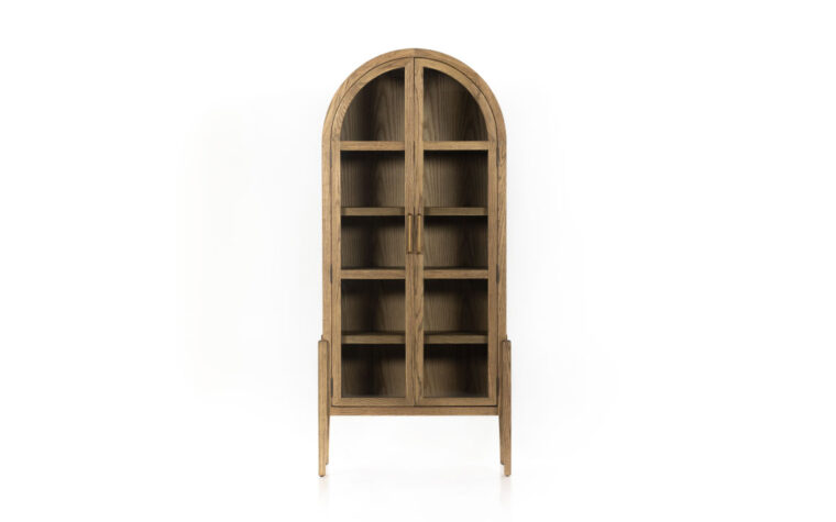 A drifted solid oak arched bookcase with matching drifted oak interiors by Four Hands.