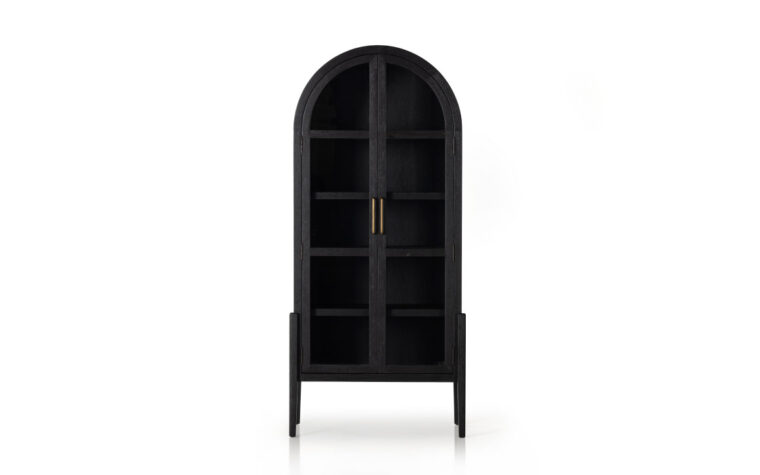 A black arched bookcase with matte black interiors by Four Hands.