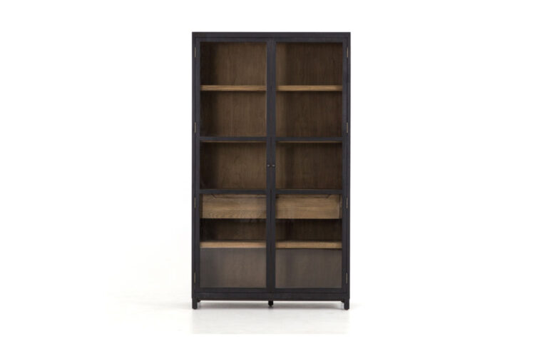 The Millie Oak Cabinet by Four Hands in drifted matte black with tempered glass doors.