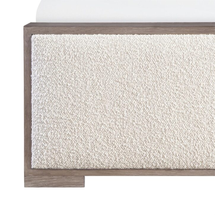 A detail shot of the fabric and wood finish of the Casa Paros Modern Queen Bed by Bernhardt.