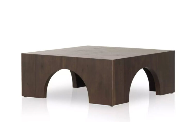 The Fausto dark wood coffee table by Four Hands, also available in Bleached wood.