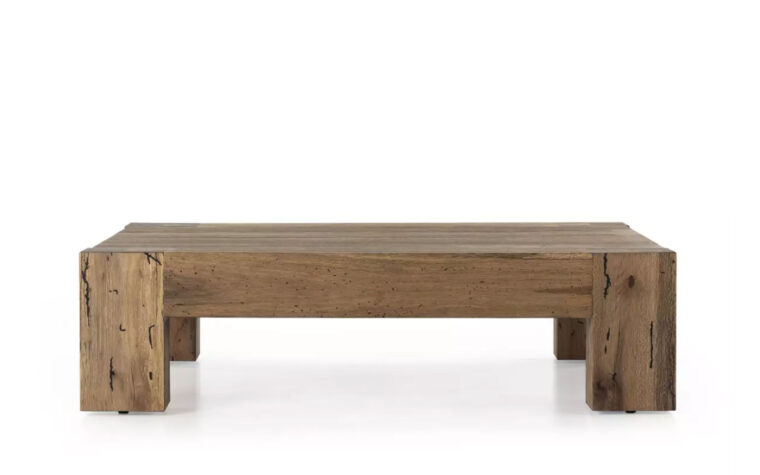 The Abaso Rustic Coffee Table by Four Hands in Rustic Wormwood Oak.