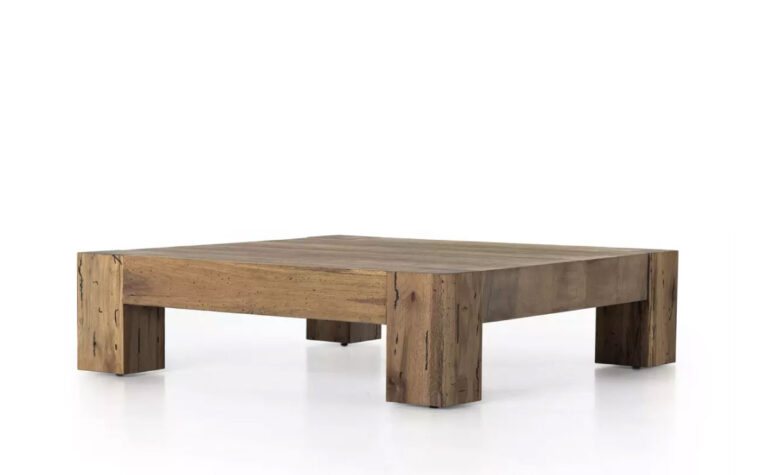 The Abaso Rustic Coffee Table by Four Hands in Rustic Wormwood Oak.