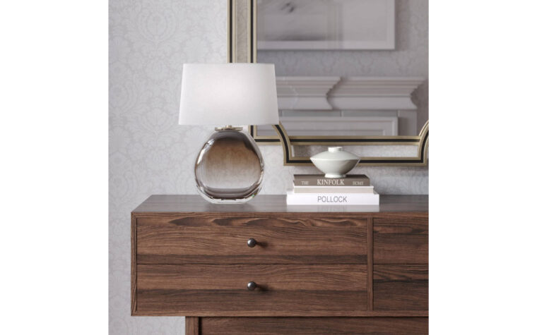 Oriole glass table lamp by Flow Decor styled on wooden sideboard.
