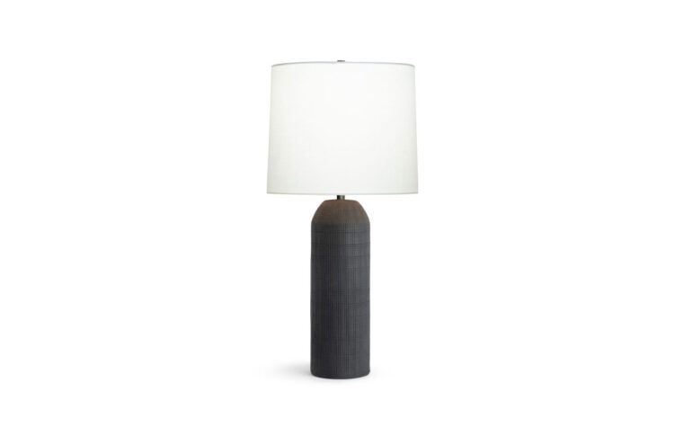 Monica contemporary black ceramic lamp by Flow Decor with light on.