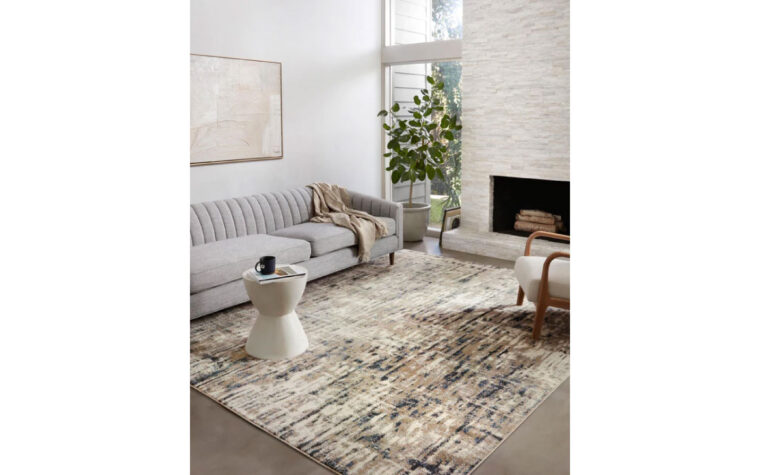 SPI-02 Stone/Blue area rug by Loloi Rugs styled in modern living room.
