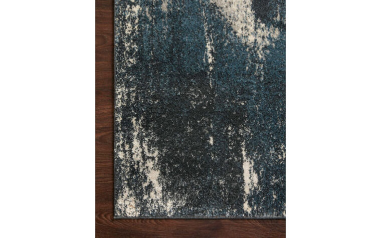 Close up corner detail of the SPI-04 Indigo/Ivory area rug by Loloi Rugs.