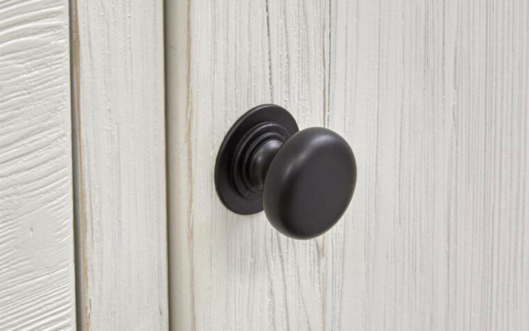 Up close detail of the handle of the Harper Springs Farmhouse White Night Stand by Magnussen.