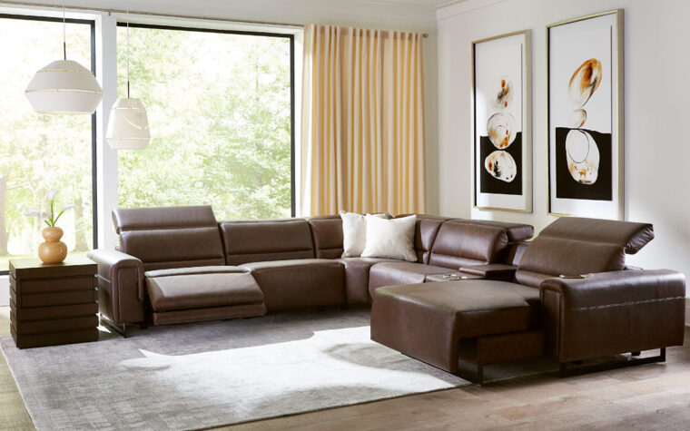 The Armina reclining sectional sofa from Palliser in dark brown leather styled in living room.