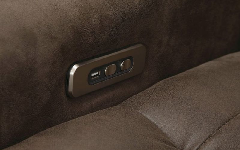 Close up of power recline buttons and USB port on the Sorrento recliner by Palliser.
