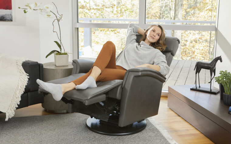 Women reclined in Rome modern recliner armchair from Fjords.