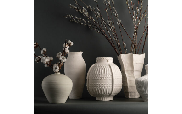Lucille white ceramic vase from FlowDecor staged with other vases