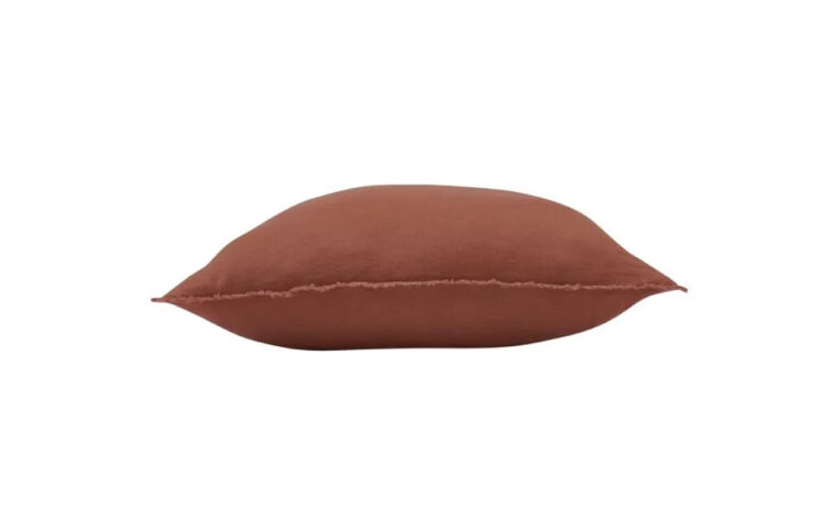Side of terracotta throw pillow by Renwil