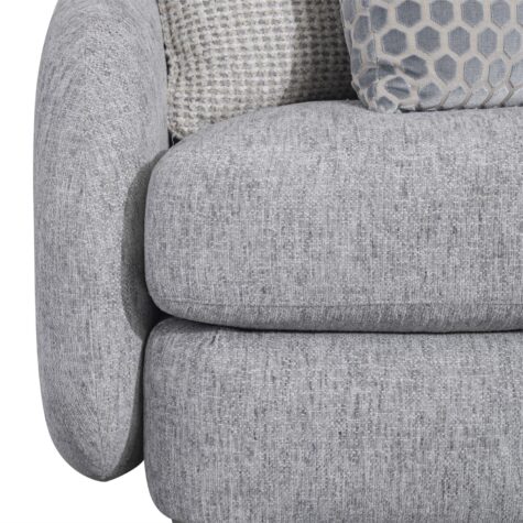 Cushion and arm details of the Indy fabric curved sofa from Bernhardt