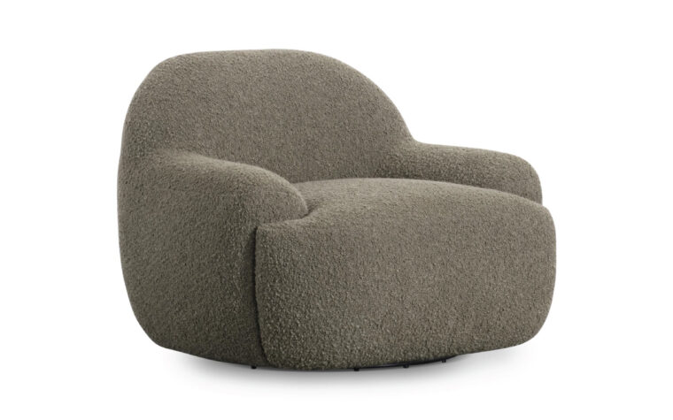 Curved oversized accent chair with low profile arms.