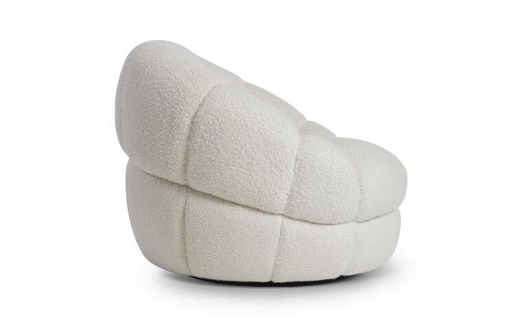 Side view of white stitch modern curved oversized chair