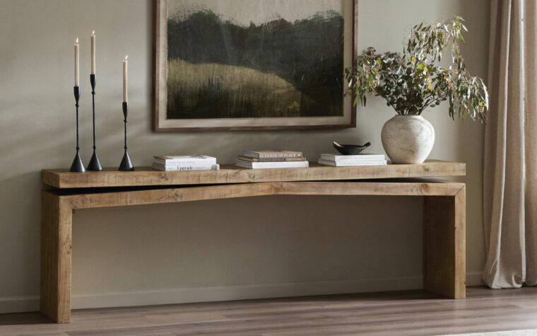 Charming mid century modern space with wood console table from Four Hands