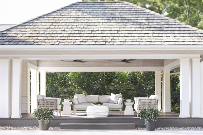 outdoor patio with an outdoor sofa set in grey fabric