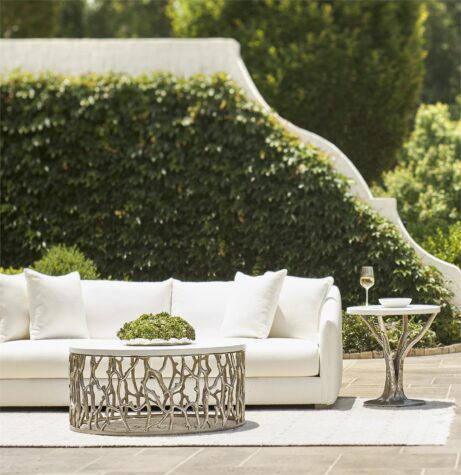 an outdoor photo in a luxury house backyard of the solana sofa in white by bernhardt