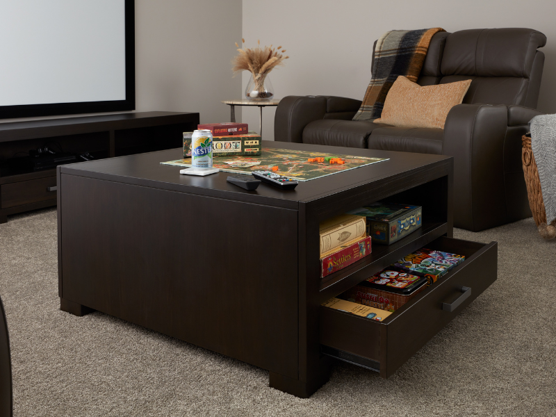 Custom coffee table in theatre room provided by design services in Waterloo, Ontario.
