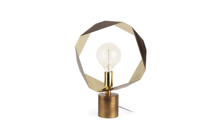 an industrial table lamp in gold with a unique octagon shape