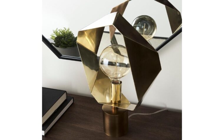 a detail shot of a cute accent table lamp that has folded metal