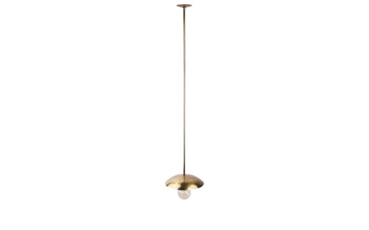 a gold hammered pendant light hanging from a ceiling