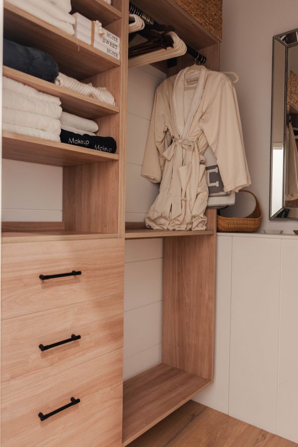 essential closet collection in a muskoka cottage in a brown finish