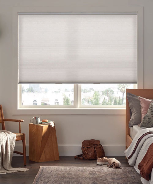 custom white alta blinds in a bedroom