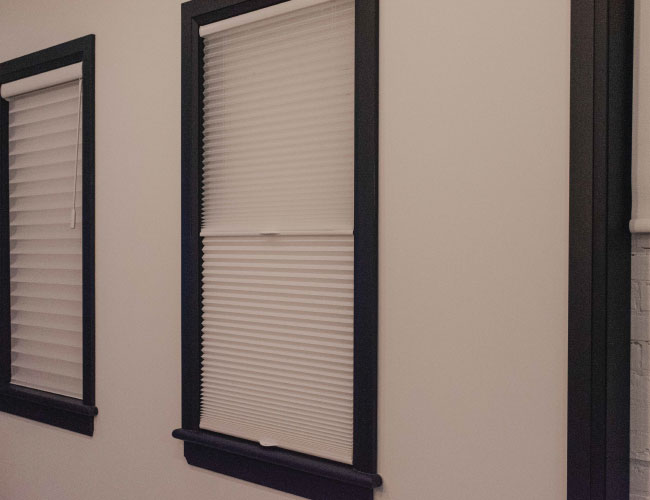 custom whtie alta blinds in chervin furniture elmira showroom