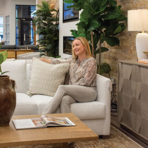 chervin furniture designer on a white sofa