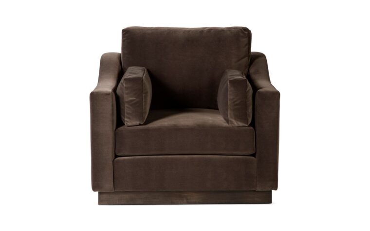 the transitional plinith club chair in a dark brown velvet with dark brown stained base by theodore alexander