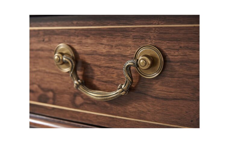 a detail of teh gold hardware on the tilbury sideboard